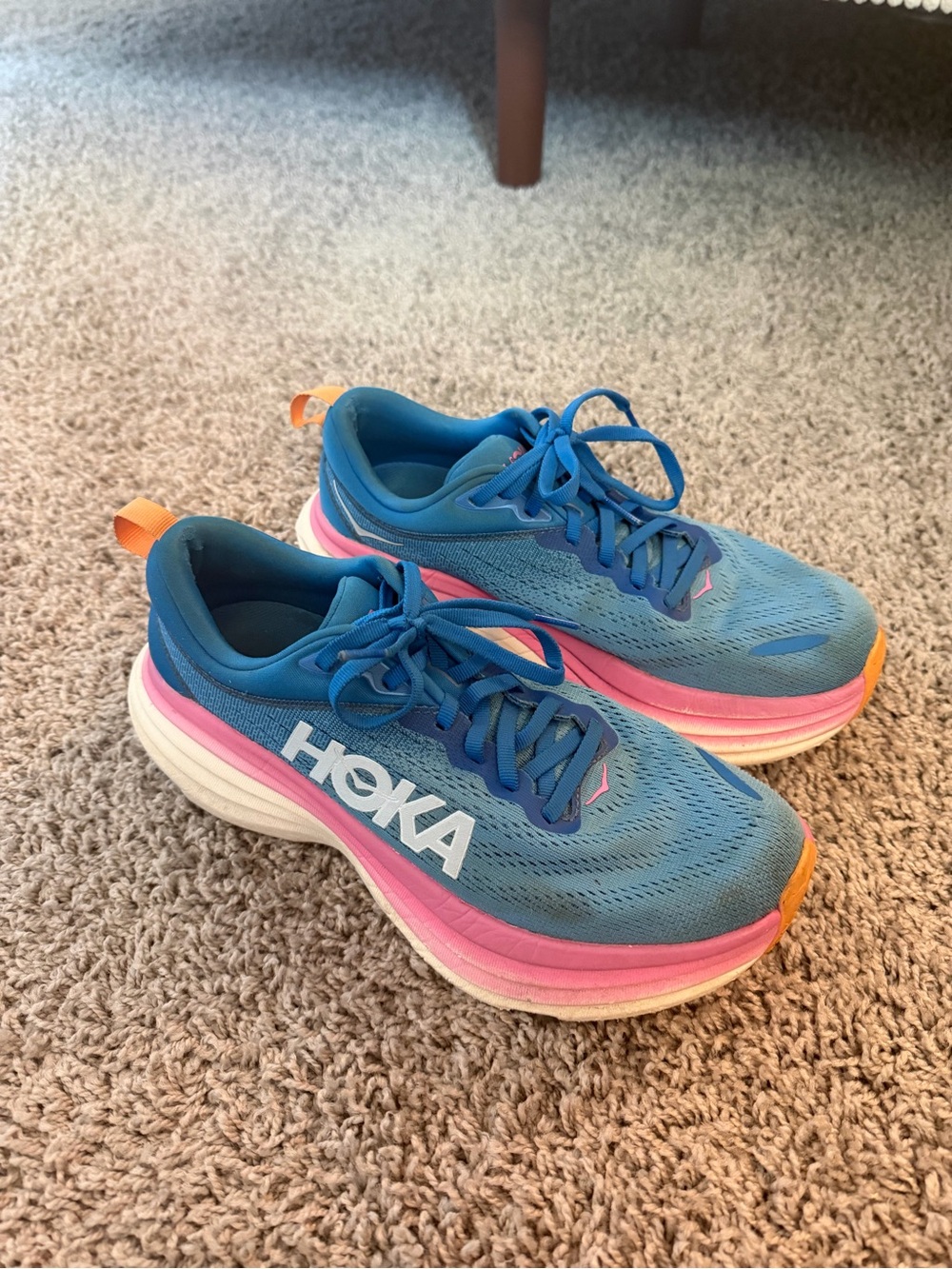 Hoka Blue Running Shoes with Pink Midsole and Orange Heel Tab